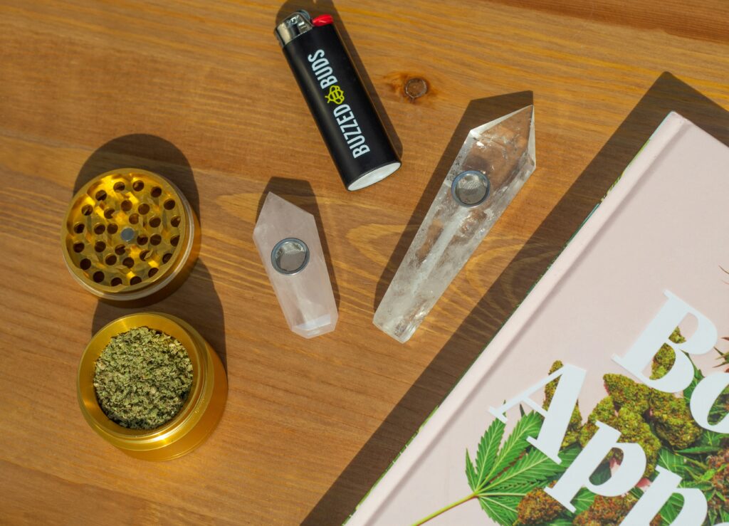 Smoke shop accessories including glassware, grinders, cigar tools, storage products and maintenance gear